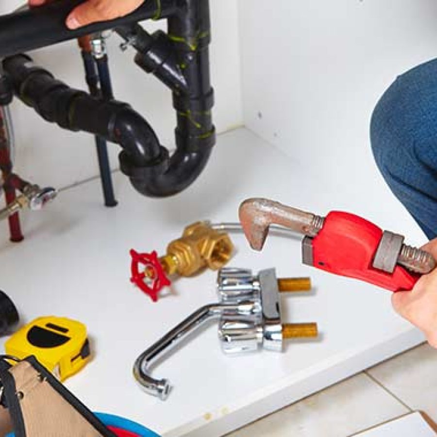 Expert plumbers repairing water system in Tehama, CA commercial building.