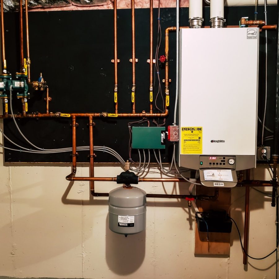Professional plumber installing water heater in Gridley, CA